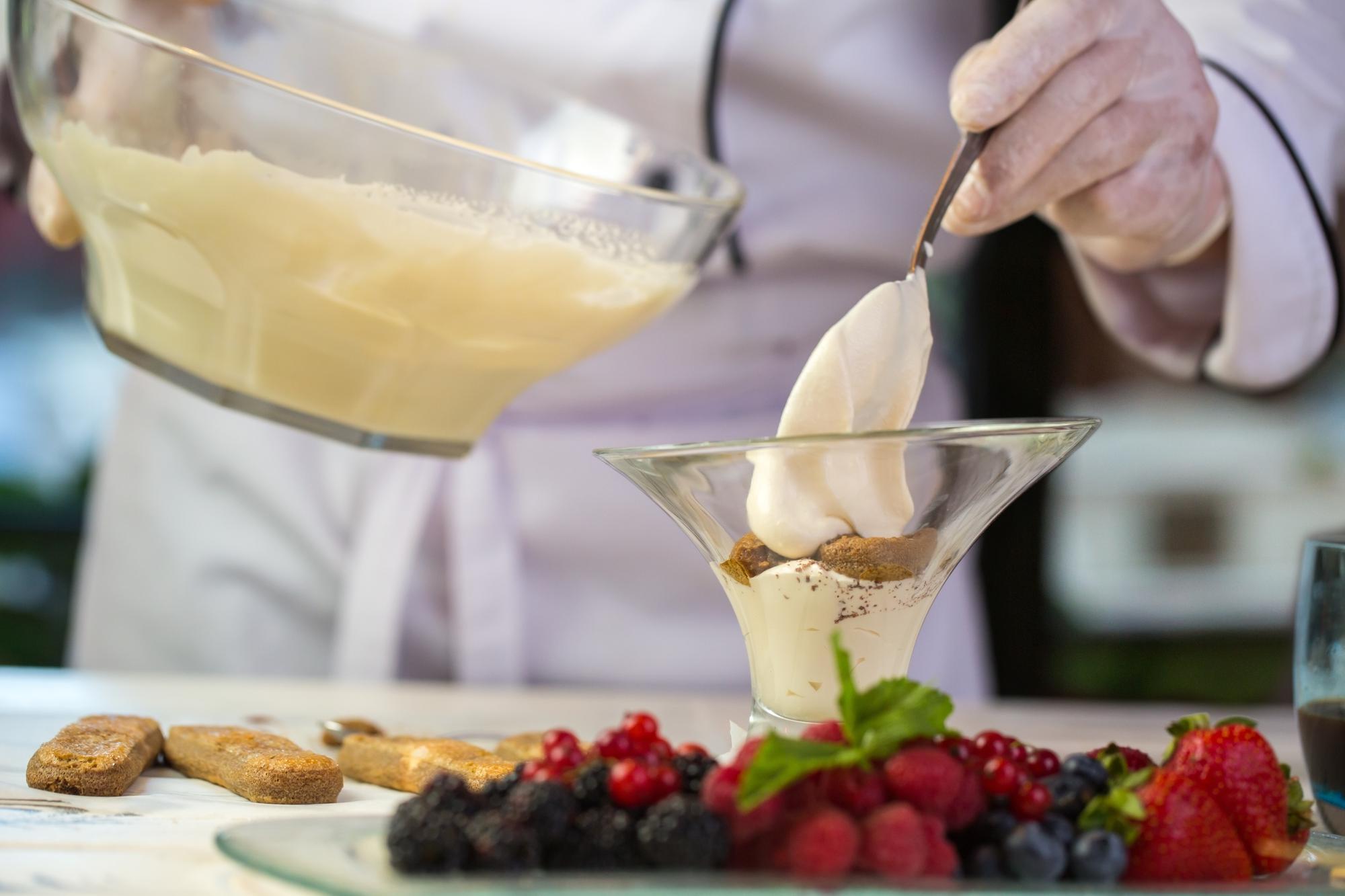 Chef preparing seasonal ingredients in studio kitchen